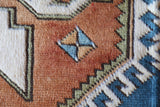Vintage Turkish rug in living room setting, old rug, antique rug, pastel colors, faded colors, Turkish rug, vintage rug, soft rug, Portland, Oregon, rug store, rug shop, local shop