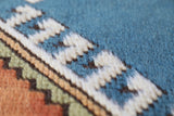 Vintage Turkish rug in living room setting, old rug, antique rug, pastel colors, faded colors, Turkish rug, vintage rug, soft rug, Portland, Oregon, rug store, rug shop, local shop