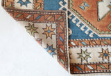 Vintage Turkish rug in living room setting, old rug, antique rug, pastel colors, faded colors, Turkish rug, vintage rug, soft rug, Portland, Oregon, rug store, rug shop, local shop