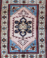 Vintage Turkish rug in a living room setting, pile rug, Turkish rug, vintage rug, portland, rug shop, bright colors, wild shaman, soft rug, bold color, Portland, Oregon, rug store, rug shop, local shop, antique rug