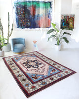 Vintage Turkish rug in a living room setting, pile rug, Turkish rug, vintage rug, portland, rug shop, bright colors, wild shaman, soft rug, bold color, Portland, Oregon, rug store, rug shop, local shop, antique rug