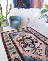 Vintage Turkish rug in a living room setting, pile rug, Turkish rug, vintage rug, portland, rug shop, bright colors, wild shaman, soft rug, bold color, Portland, Oregon, rug store, rug shop, local shop, antique rug