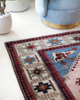 Vintage Turkish rug in a living room setting, pile rug, Turkish rug, vintage rug, portland, rug shop, bright colors, wild shaman, soft rug, bold color, Portland, Oregon, rug store, rug shop, local shop, antique rug