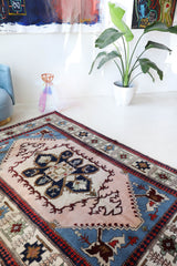 Vintage Turkish rug in a living room setting, pile rug, Turkish rug, vintage rug, portland, rug shop, bright colors, wild shaman, soft rug, bold color, Portland, Oregon, rug store, rug shop, local shop, antique rug