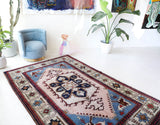 Vintage Turkish rug in a living room setting, pile rug, Turkish rug, vintage rug, portland, rug shop, bright colors, wild shaman, soft rug, bold color, Portland, Oregon, rug store, rug shop, local shop, antique rug