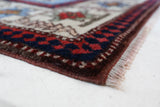 Vintage Turkish rug in a living room setting, pile rug, Turkish rug, vintage rug, portland, rug shop, bright colors, wild shaman, soft rug, bold color, Portland, Oregon, rug store, rug shop, local shop, antique rug