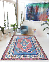 Vintage Turkish rug in a living room setting, pile rug, Turkish rug, vintage rug, portland, rug shop, bright colors, wild shaman, soft rug, bold color, Portland, Oregon, rug store, rug shop, local shop, antique rug