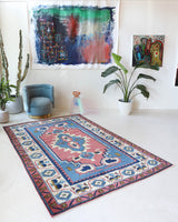 Vintage Turkish rug in a living room setting, pile rug, Turkish rug, vintage rug, portland, rug shop, bright colors, wild shaman, soft rug, bold color, Portland, Oregon, rug store, rug shop, local shop, antique rug