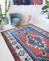 Vintage Turkish rug in a living room setting, pile rug, Turkish rug, vintage rug, portland, rug shop, bright colors, wild shaman, soft rug, bold color, Portland, Oregon, rug store, rug shop, local shop, antique rug