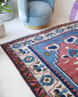 Vintage Turkish rug in a living room setting, pile rug, Turkish rug, vintage rug, portland, rug shop, bright colors, wild shaman, soft rug, bold color, Portland, Oregon, rug store, rug shop, local shop, antique rug