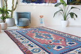 Vintage Turkish rug in a living room setting, pile rug, Turkish rug, vintage rug, portland, rug shop, bright colors, wild shaman, soft rug, bold color, Portland, Oregon, rug store, rug shop, local shop, antique rug