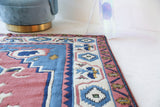 Vintage Turkish rug in a living room setting, pile rug, Turkish rug, vintage rug, portland, rug shop, bright colors, wild shaman, soft rug, bold color, Portland, Oregon, rug store, rug shop, local shop, antique rug