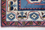 Vintage Turkish rug in a living room setting, pile rug, Turkish rug, vintage rug, portland, rug shop, bright colors, wild shaman, soft rug, bold color, Portland, Oregon, rug store, rug shop, local shop, antique rug