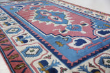 Vintage Turkish rug in a living room setting, pile rug, Turkish rug, vintage rug, portland, rug shop, bright colors, wild shaman, soft rug, bold color, Portland, Oregon, rug store, rug shop, local shop, antique rug