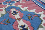 Vintage Turkish rug in a living room setting, pile rug, Turkish rug, vintage rug, portland, rug shop, bright colors, wild shaman, soft rug, bold color, Portland, Oregon, rug store, rug shop, local shop, antique rug