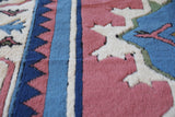 Vintage Turkish rug in a living room setting, pile rug, Turkish rug, vintage rug, portland, rug shop, bright colors, wild shaman, soft rug, bold color, Portland, Oregon, rug store, rug shop, local shop, antique rug