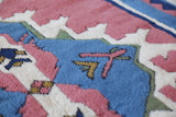 Vintage Turkish rug in a living room setting, pile rug, Turkish rug, vintage rug, portland, rug shop, bright colors, wild shaman, soft rug, bold color, Portland, Oregon, rug store, rug shop, local shop, antique rug