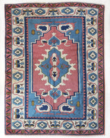 Vintage Turkish rug in a living room setting, pile rug, Turkish rug, vintage rug, portland, rug shop, bright colors, wild shaman, soft rug, bold color, Portland, Oregon, rug store, rug shop, local shop, antique rug