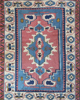 Vintage Turkish rug in a living room setting, pile rug, Turkish rug, vintage rug, portland, rug shop, bright colors, wild shaman, soft rug, bold color, Portland, Oregon, rug store, rug shop, local shop, antique rug