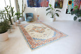 Vintage Turkish rug in a living room setting, pile rug, Turkish rug, vintage rug, portland, rug shop, bright colors, wild shaman, soft rug, bold color, Portland, Oregon, rug store, rug shop, local shop, antique rug