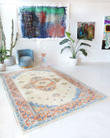 Vintage Turkish rug in a living room setting, pile rug, Turkish rug, vintage rug, portland, rug shop, bright colors, wild shaman, soft rug, bold color, Portland, Oregon, rug store, rug shop, local shop, antique rug