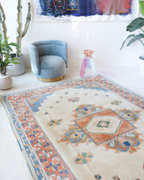Vintage Turkish rug in a living room setting, pile rug, Turkish rug, vintage rug, portland, rug shop, bright colors, wild shaman, soft rug, bold color, Portland, Oregon, rug store, rug shop, local shop, antique rug