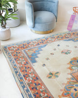 Vintage Turkish rug in a living room setting, pile rug, Turkish rug, vintage rug, portland, rug shop, bright colors, wild shaman, soft rug, bold color, Portland, Oregon, rug store, rug shop, local shop, antique rug