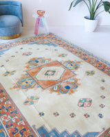 Vintage Turkish rug in a living room setting, pile rug, Turkish rug, vintage rug, portland, rug shop, bright colors, wild shaman, soft rug, bold color, Portland, Oregon, rug store, rug shop, local shop, antique rug
