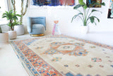 Vintage Turkish rug in a living room setting, pile rug, Turkish rug, vintage rug, portland, rug shop, bright colors, wild shaman, soft rug, bold color, Portland, Oregon, rug store, rug shop, local shop, antique rug