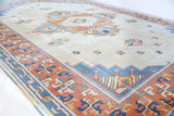 Vintage Turkish rug in a living room setting, pile rug, Turkish rug, vintage rug, portland, rug shop, bright colors, wild shaman, soft rug, bold color, Portland, Oregon, rug store, rug shop, local shop, antique rug