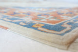 Vintage Turkish rug in a living room setting, pile rug, Turkish rug, vintage rug, portland, rug shop, bright colors, wild shaman, soft rug, bold color, Portland, Oregon, rug store, rug shop, local shop, antique rug