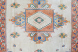 Vintage Turkish rug in a living room setting, pile rug, Turkish rug, vintage rug, portland, rug shop, bright colors, wild shaman, soft rug, bold color, Portland, Oregon, rug store, rug shop, local shop, antique rug