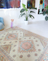 Vintage Turkish rug in living room setting, old rug, antique rug, pastel colors, faded colors, Turkish rug, vintage rug, soft rug, Portland, Oregon, rug store, rug shop, local shop