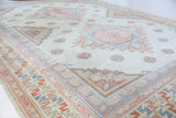 Vintage Turkish rug in living room setting, old rug, antique rug, pastel colors, faded colors, Turkish rug, vintage rug, soft rug, Portland, Oregon, rug store, rug shop, local shop