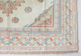 Vintage Turkish rug in living room setting, old rug, antique rug, pastel colors, faded colors, Turkish rug, vintage rug, soft rug, Portland, Oregon, rug store, rug shop, local shop