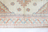 Vintage Turkish rug in living room setting, old rug, antique rug, pastel colors, faded colors, Turkish rug, vintage rug, soft rug, Portland, Oregon, rug store, rug shop, local shop