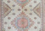 Vintage Turkish rug in living room setting, old rug, antique rug, pastel colors, faded colors, Turkish rug, vintage rug, soft rug, Portland, Oregon, rug store, rug shop, local shop