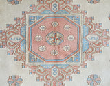 Vintage Turkish rug in living room setting, old rug, antique rug, pastel colors, faded colors, Turkish rug, vintage rug, soft rug, Portland, Oregon, rug store, rug shop, local shop