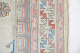Vintage Turkish rug in living room setting, old rug, antique rug, pastel colors, faded colors, Turkish rug, vintage rug, soft rug, Portland, Oregon, rug store, rug shop, local shop