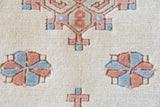 Vintage Turkish rug in living room setting, old rug, antique rug, pastel colors, faded colors, Turkish rug, vintage rug, soft rug, Portland, Oregon, rug store, rug shop, local shop