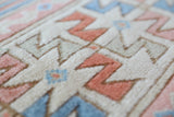 Vintage Turkish rug in living room setting, old rug, antique rug, pastel colors, faded colors, Turkish rug, vintage rug, soft rug, Portland, Oregon, rug store, rug shop, local shop