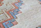 Vintage Turkish rug in living room setting, old rug, antique rug, pastel colors, faded colors, Turkish rug, vintage rug, soft rug, Portland, Oregon, rug store, rug shop, local shop