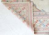 Vintage Turkish rug in living room setting, old rug, antique rug, pastel colors, faded colors, Turkish rug, vintage rug, soft rug, Portland, Oregon, rug store, rug shop, local shop