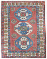 Vintage Turkish rug in a living room setting, pile rug, Turkish rug, vintage rug, portland, rug shop, bright colors, wild shaman, soft rug, bold color, Portland, Oregon, rug store, rug shop, local shop, antique rug