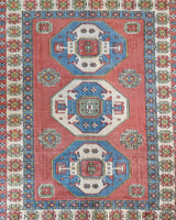 Vintage Turkish rug in a living room setting, pile rug, Turkish rug, vintage rug, portland, rug shop, bright colors, wild shaman, soft rug, bold color, Portland, Oregon, rug store, rug shop, local shop, antique rug