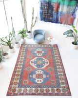 Vintage Turkish rug in a living room setting, pile rug, Turkish rug, vintage rug, portland, rug shop, bright colors, wild shaman, soft rug, bold color, Portland, Oregon, rug store, rug shop, local shop, antique rug