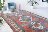 Vintage Turkish rug in a living room setting, pile rug, Turkish rug, vintage rug, portland, rug shop, bright colors, wild shaman, soft rug, bold color, Portland, Oregon, rug store, rug shop, local shop, antique rug