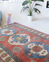 Vintage Turkish rug in a living room setting, pile rug, Turkish rug, vintage rug, portland, rug shop, bright colors, wild shaman, soft rug, bold color, Portland, Oregon, rug store, rug shop, local shop, antique rug