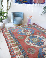 Vintage Turkish rug in a living room setting, pile rug, Turkish rug, vintage rug, portland, rug shop, bright colors, wild shaman, soft rug, bold color, Portland, Oregon, rug store, rug shop, local shop, antique rug