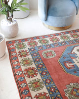 Vintage Turkish rug in a living room setting, pile rug, Turkish rug, vintage rug, portland, rug shop, bright colors, wild shaman, soft rug, bold color, Portland, Oregon, rug store, rug shop, local shop, antique rug